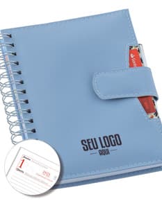 Agenda Wire-o com capa azul, espaço para anotações e espiral na lateral.